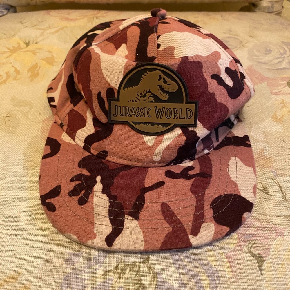 Camouflage pattern Jurassic World SnapBack adjustable hat.